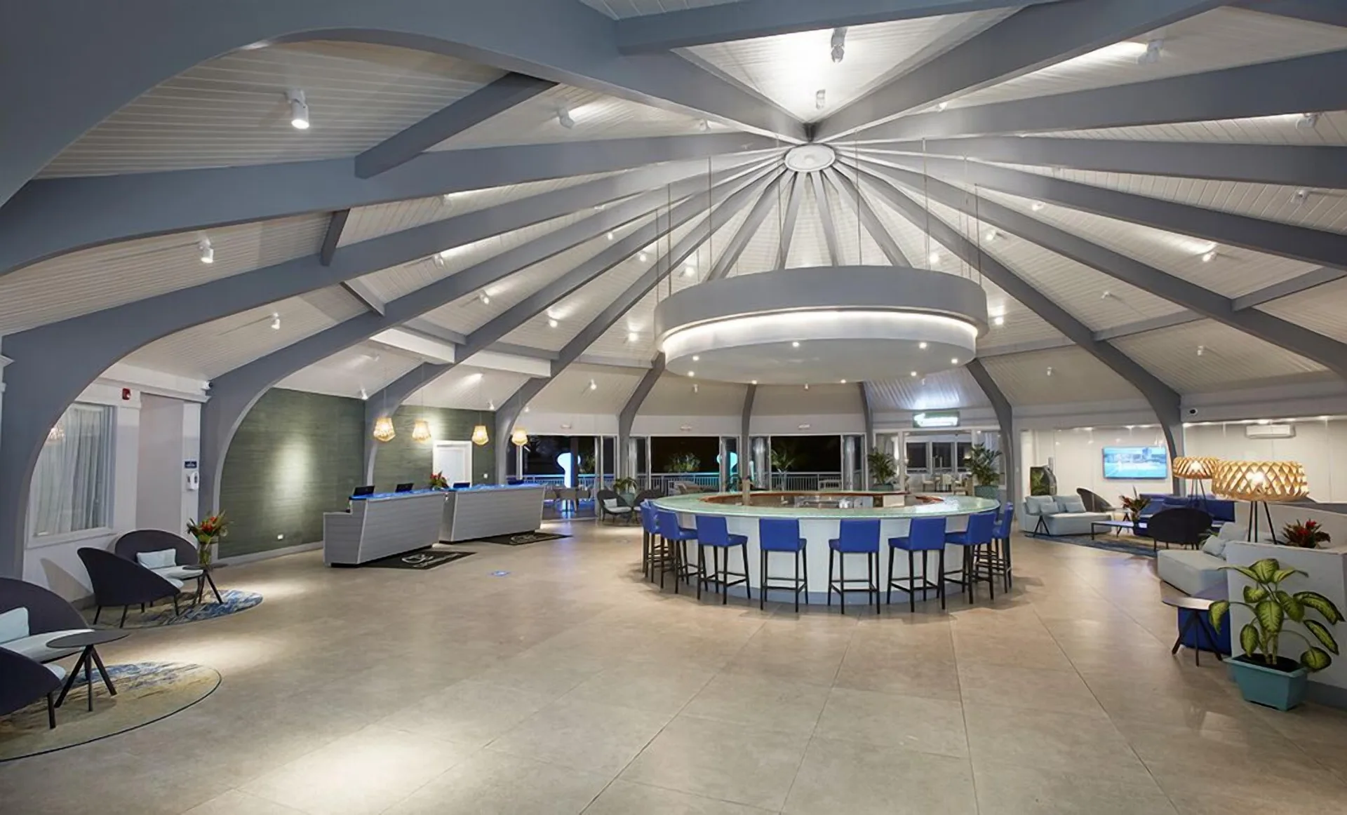 Spacious lobby bar with vaulted ceiling at Carina Bay Boutique Resort & Casino.