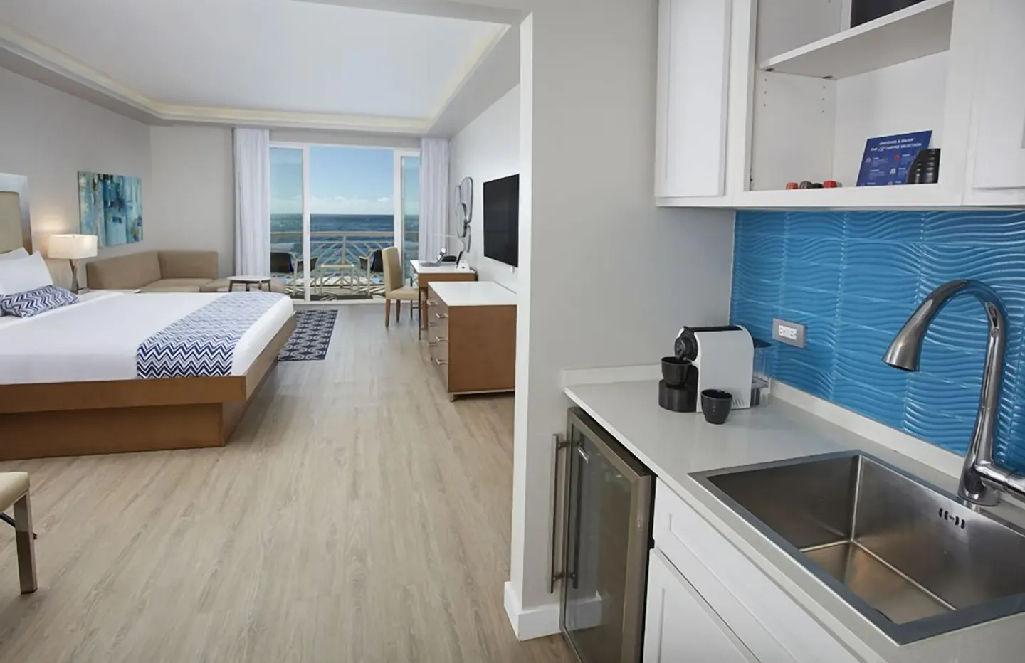 Beachfront king room with kitchenette and ocean balcony at Carina Bay Boutique Resort & Casino.