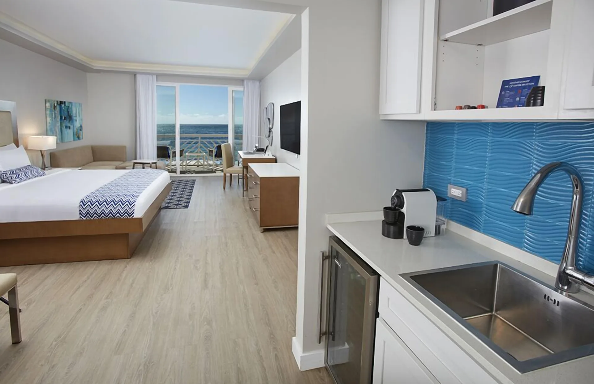 Beachfront king room with kitchenette and ocean balcony at Carina Bay Boutique Resort & Casino.