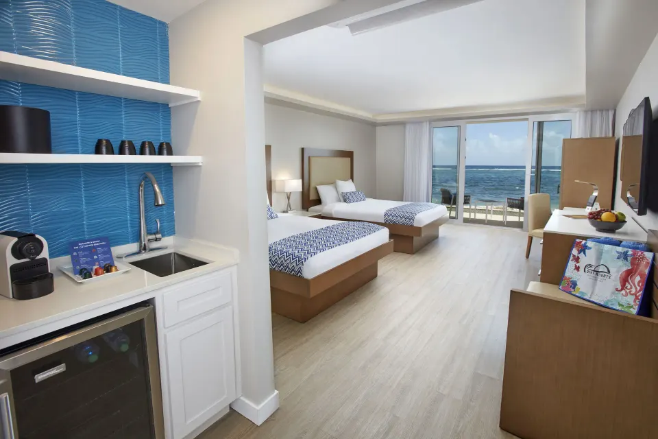 Beachfront two-bed room with kitchenette and ocean view at Carina Bay Boutique Resort & Casino.