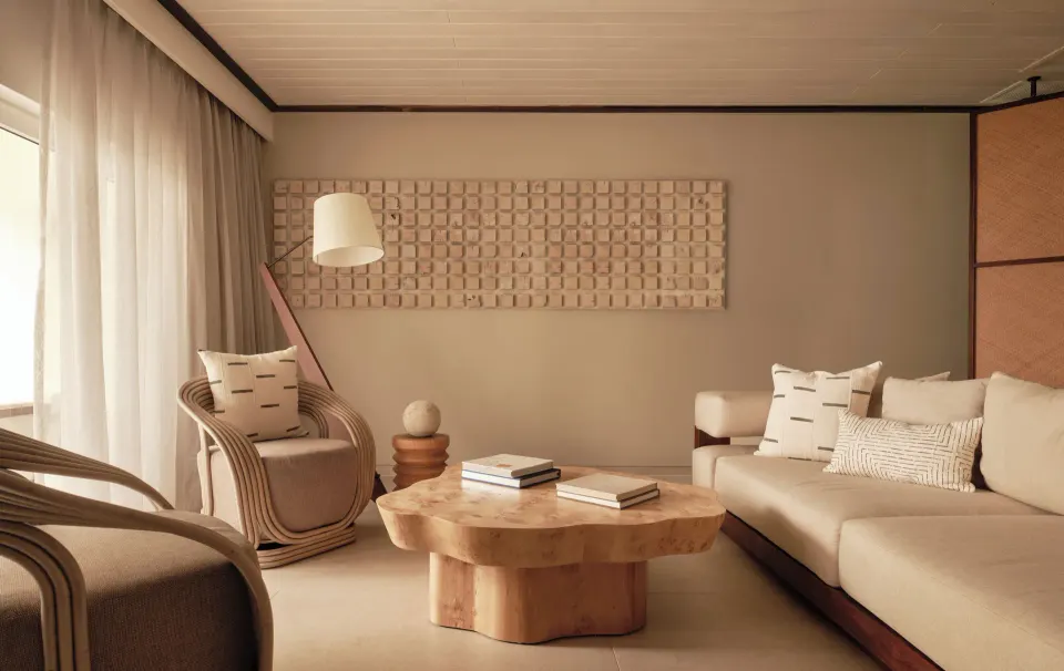 Bay Suite living area with sofa and armchairs at Carlisle Bay.