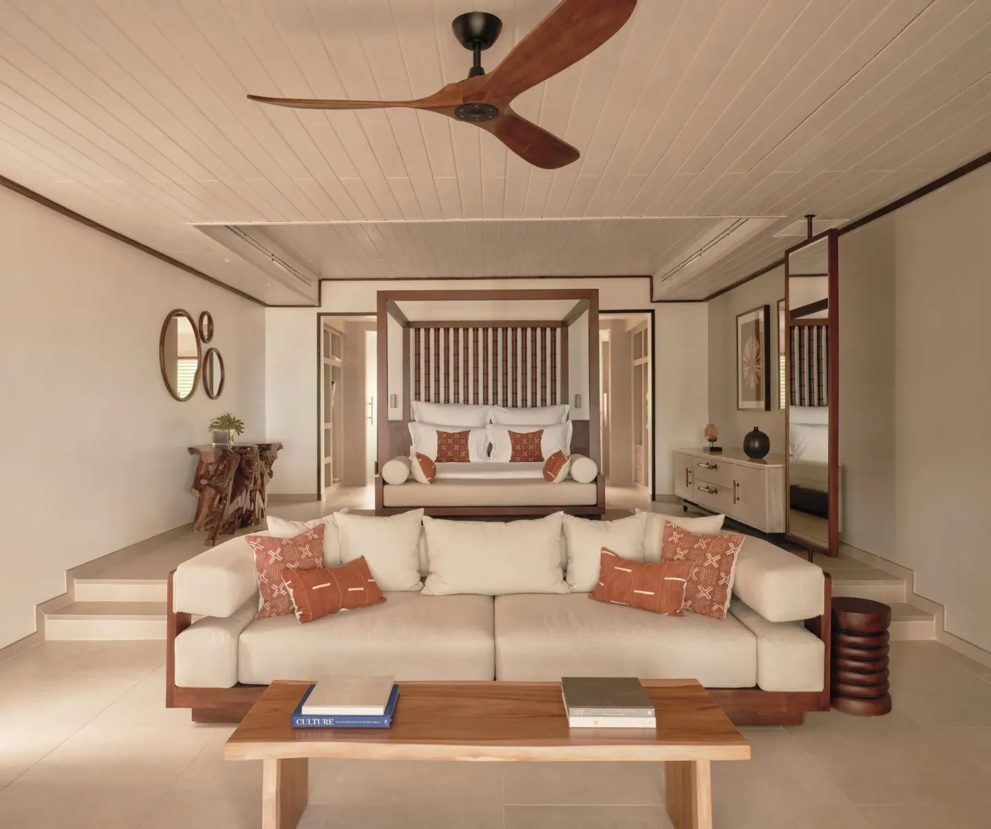 Ocean Suite with sofa and four-poster king bed at Carlisle Bay.