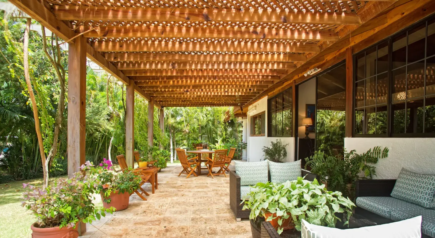 Garden patio with pergola seating at Casa de Campo Resort and Villas and Villas and Villas.
