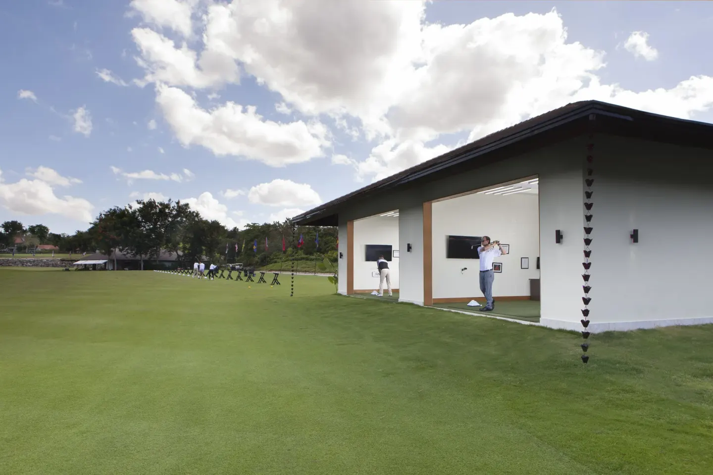 Golfers practice at a driving range at Casa de Campo Resort and Villas.