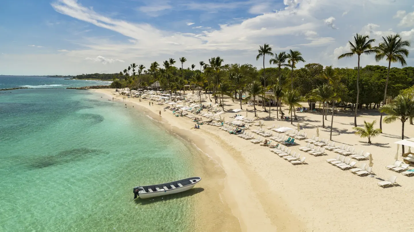 Aerial view of the beach, clear water and loungers at Casa de Campo Resort and Villas and Villas and Villas.