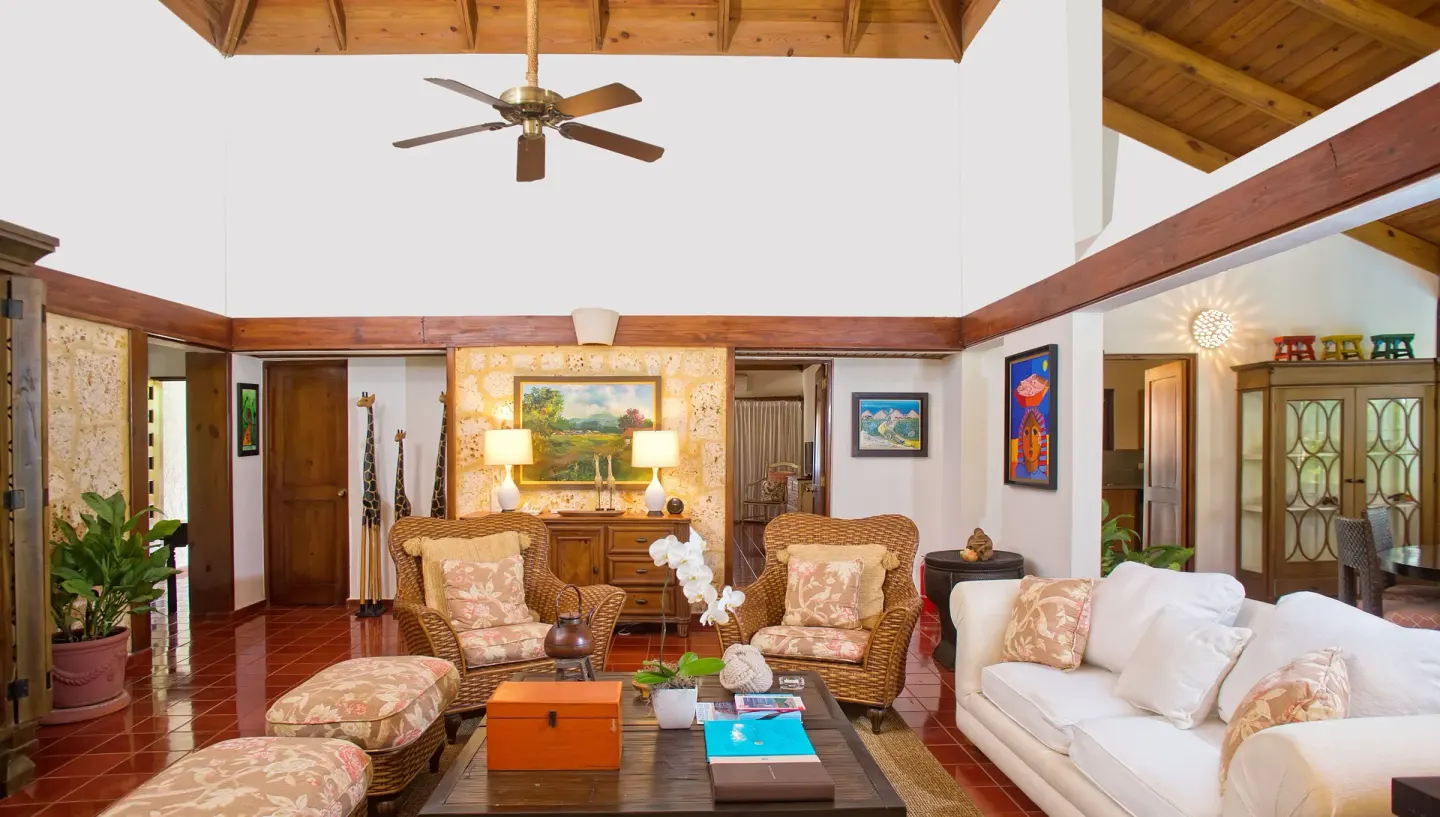 Spacious villa sitting room with wicker armchairs at Casa de Campo Resort and Villas and Villas and Villas.