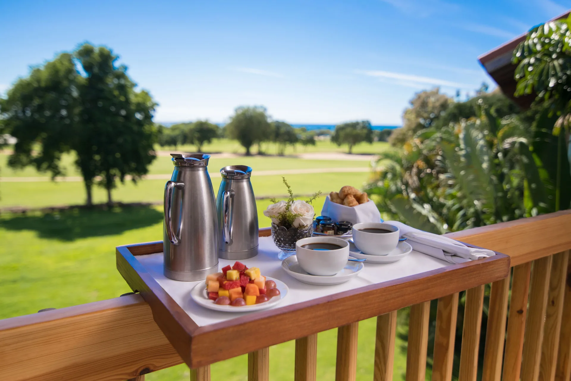 Breakfast tray on a balcony overlooking lawns at Casa de Campo Resort and Villas.