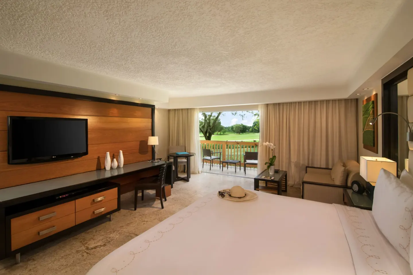 Elite Deluxe king room with balcony view at Casa de Campo Resort and Villas.