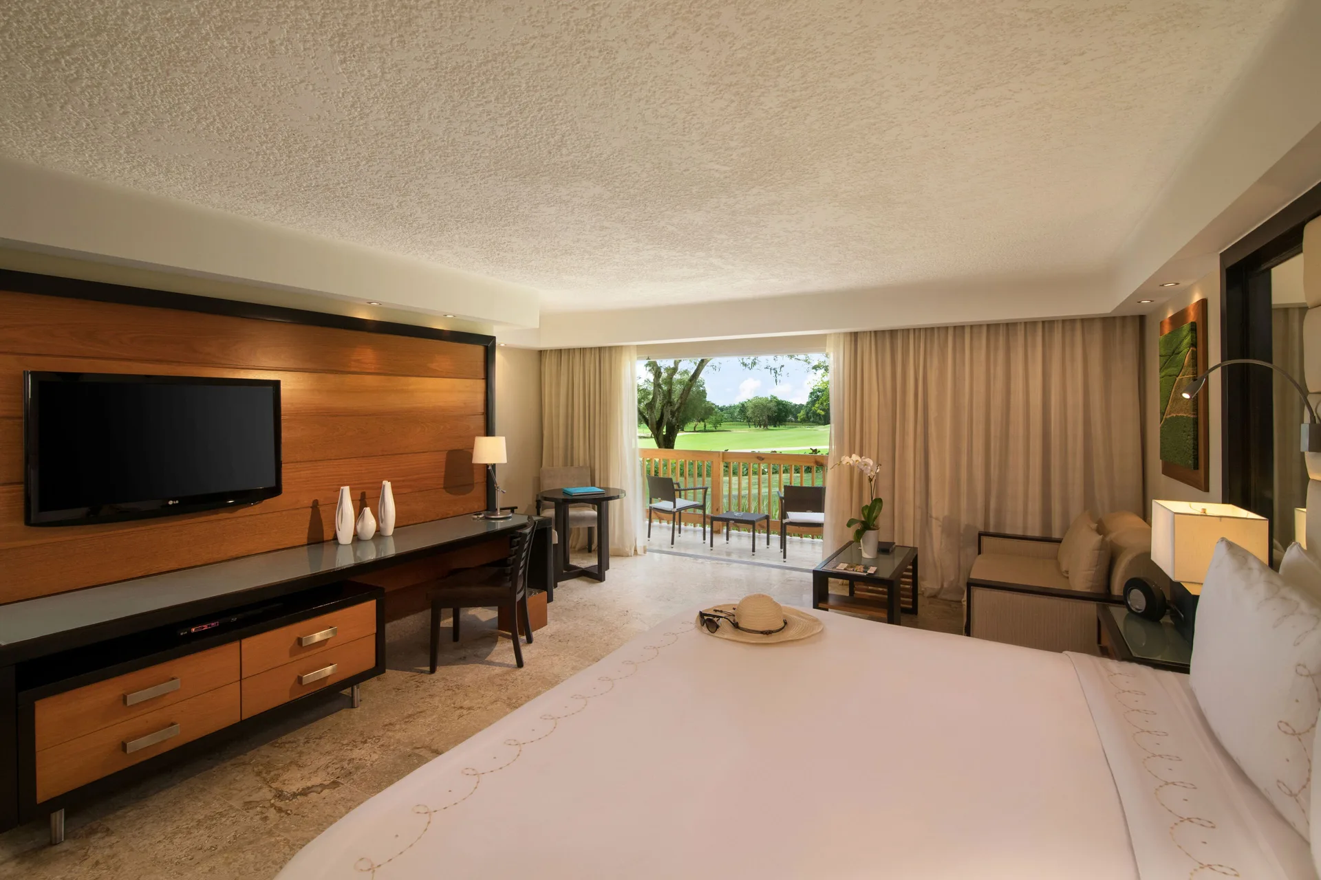 Elite Deluxe king room with balcony view at Casa de Campo Resort and Villas.