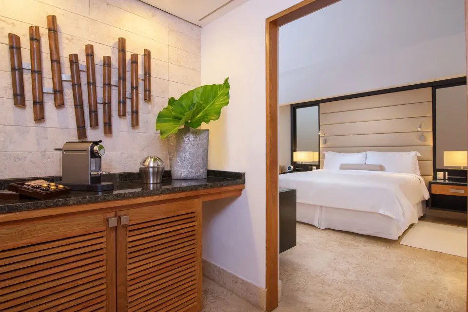 Elite Deluxe refreshment counter and king bedroom at Casa de Campo Resort and Villas.