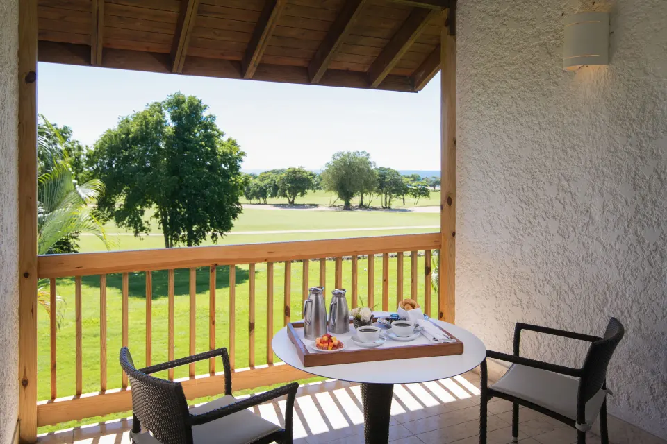 Elite Room patio breakfast table overlooking golf at Casa de Campo Resort and Villas.