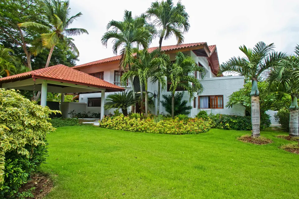 Garden villa exterior with red tile roofs at Casa de Campo Resort and Villas.