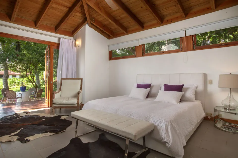 Bedroom with terrace access in a Four Bedroom Garden Villa at Casa de Campo Resort and Villas.
