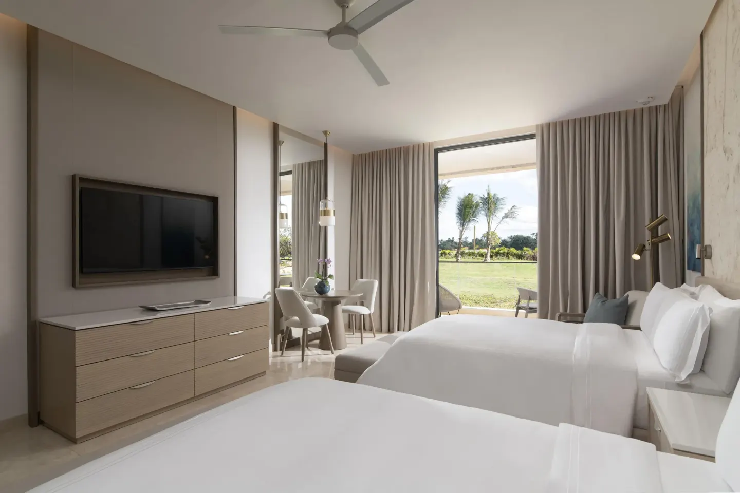 Premier Jr. Suite with two beds and patio view at Casa de Campo Resort and Villas and Villas and Villas.