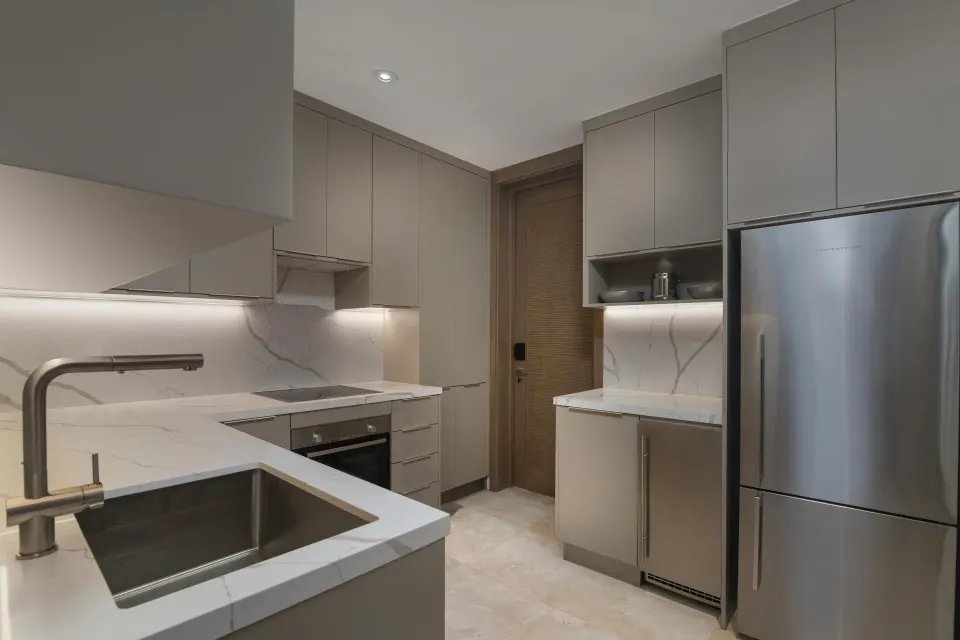 Premier Presidential Suite kitchen at Casa de Campo Resort and Villas with marble counters.