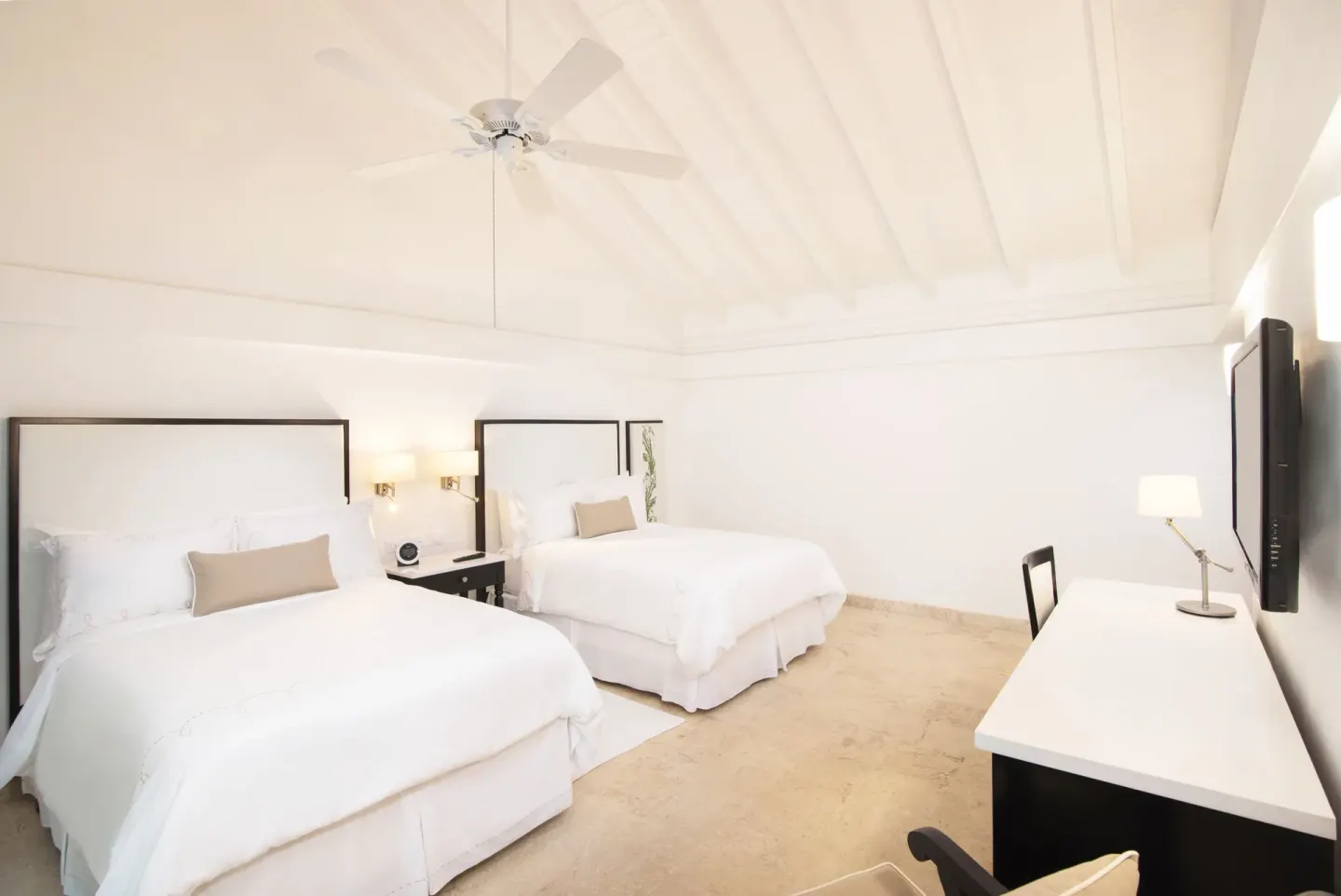 Superior Casita double-bed guest room at Casa de Campo Resort and Villas with white vaulted ceiling.