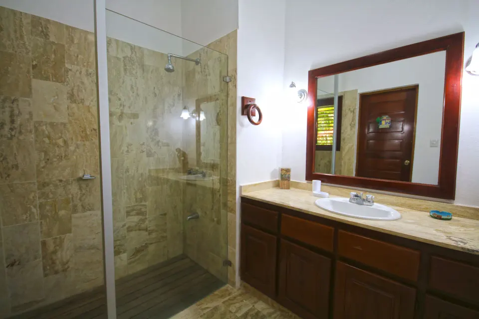 Three Bedroom Garden Villa bathroom with glass shower at Casa de Campo Resort and Villas.