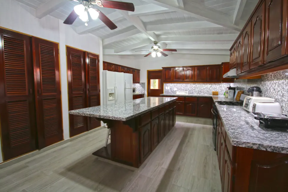 Three Bedroom Garden Villa kitchen with granite counters at Casa de Campo Resort and Villas.
