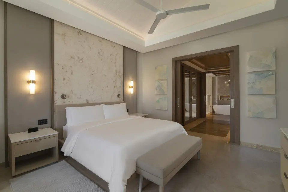 Primary bedroom with king bed in a Two Bedroom Luxury Premier Suite at Casa de Campo Resort and Villas.