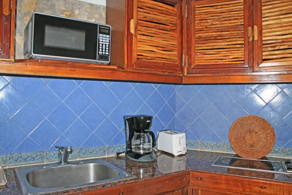 Kitchenette with microwave, coffee maker and toaster at Casa del Mar Cozumel Hotel & Dive Resort
