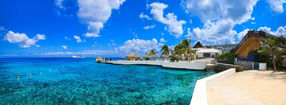 Seaside panorama of blue Caribbean waters and resort waterfront at Casa del Mar Cozumel Hotel & Dive Resort