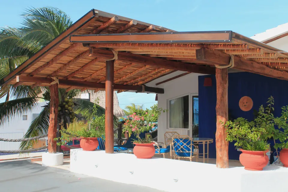 Shaded private terrace with potted plants at Casa del Mar Cozumel Hotel & Dive Resort