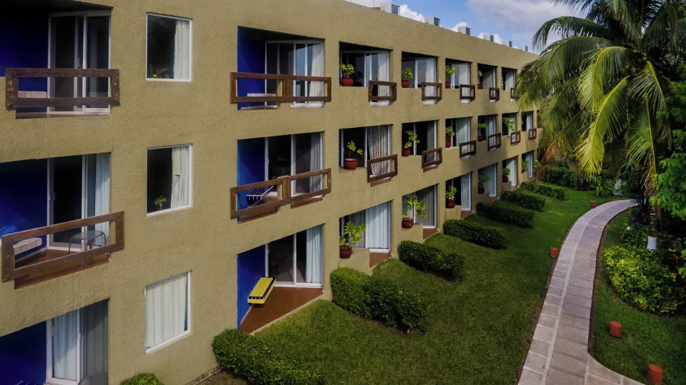 Exterior row of balconies overlooking gardens at Casa del Mar Cozumel Hotel & Dive Resort