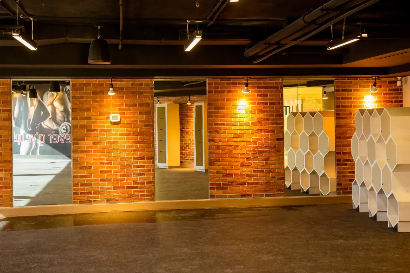 Fitness studio area with brick walls and mirrors at Casa Dorada Los Cabos Resort & Spa.