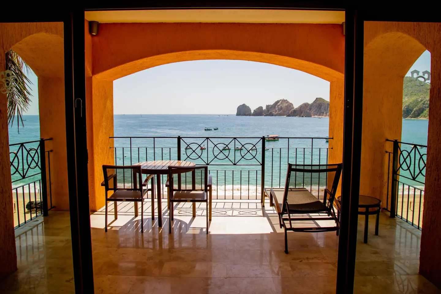 Large ocean-view terrace with lounge chair at Casa Dorada Los Cabos Resort & Spa.