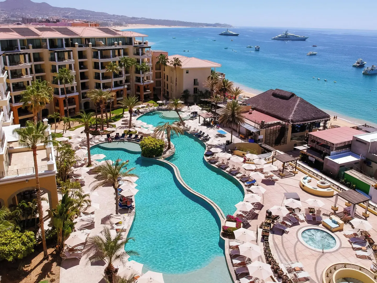 Aerial view of the pool, beach, and resort buildings at Casa Dorada Los Cabos Resort & Spa.