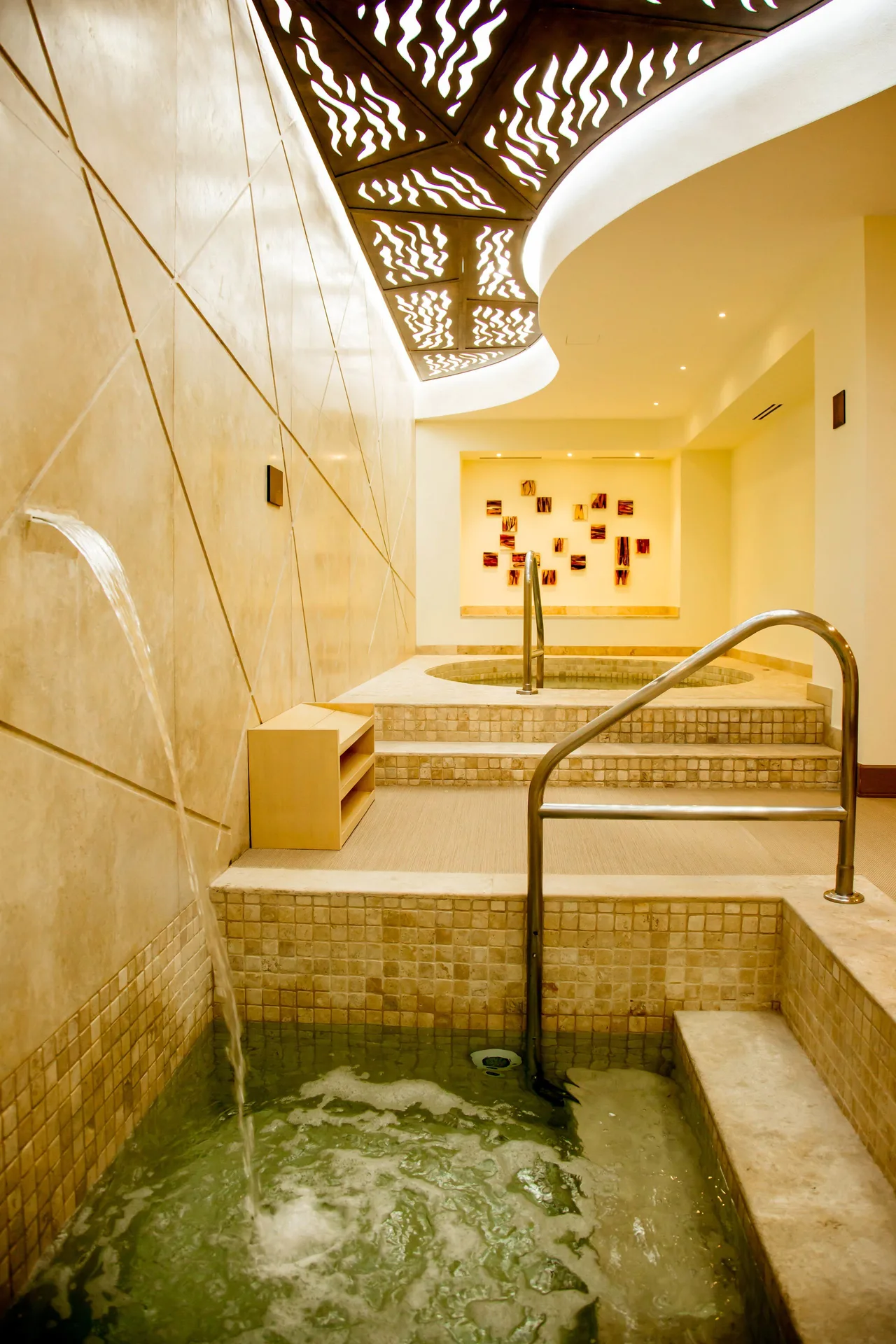 Spa hydrotherapy pool with a wall water feature at Casa Dorada Los Cabos Resort & Spa.