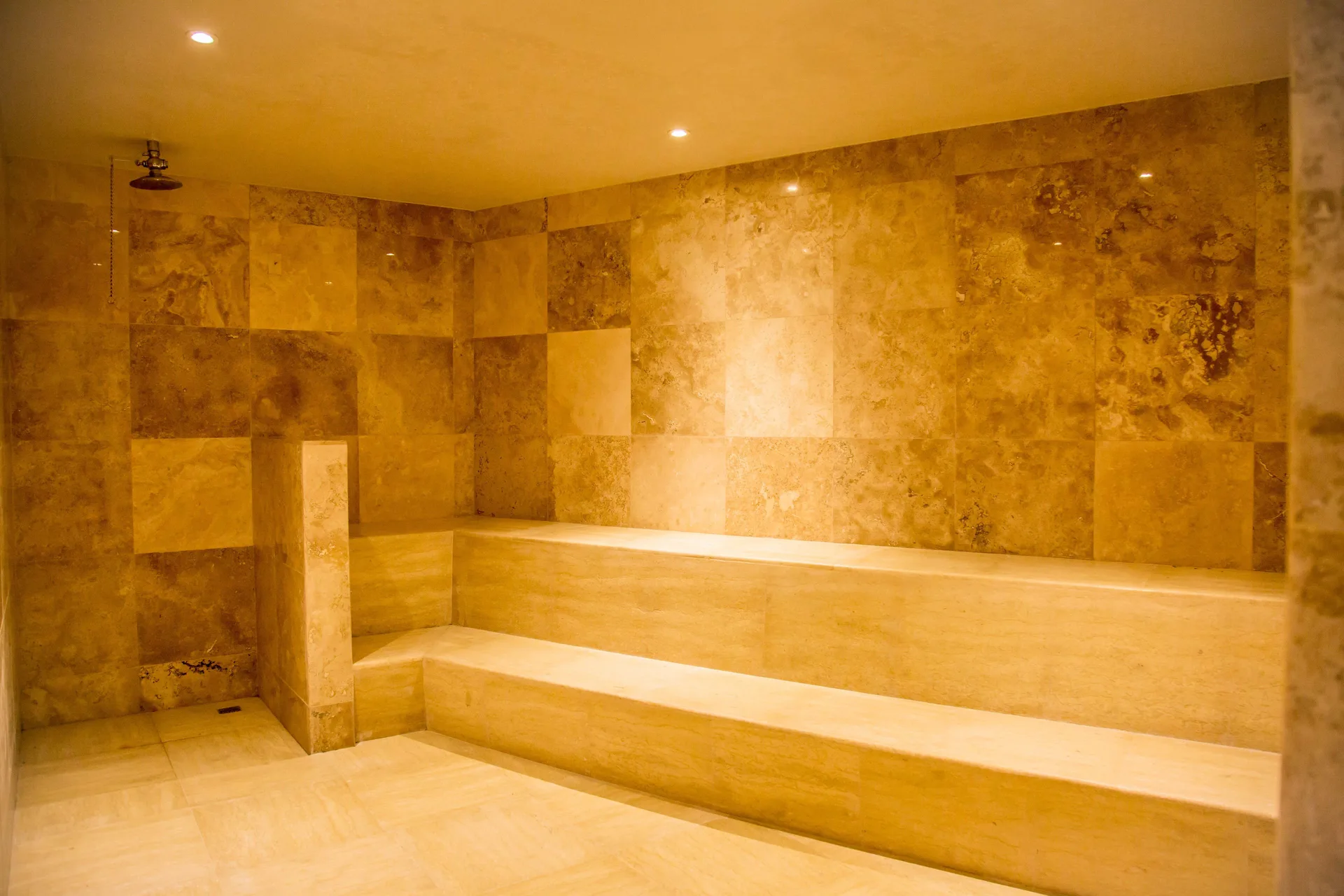 Tiled steam room with bench seating at Casa Dorada Los Cabos Resort & Spa.