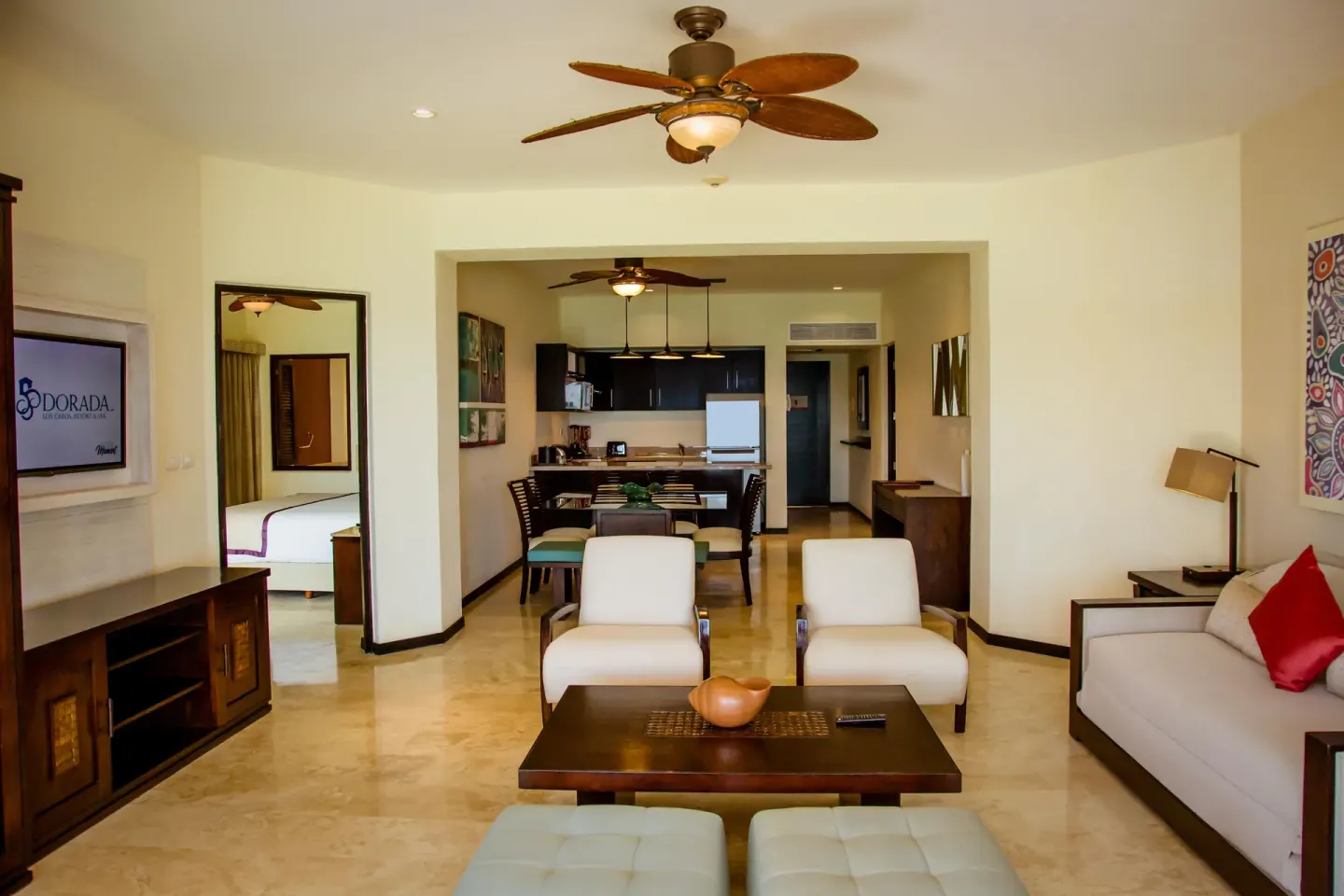 Open suite living area with kitchen and bedroom beyond at Casa Dorada Los Cabos Resort & Spa.