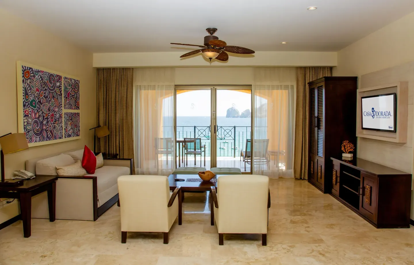 Suite living room with balcony ocean view at Casa Dorada Los Cabos Resort & Spa.