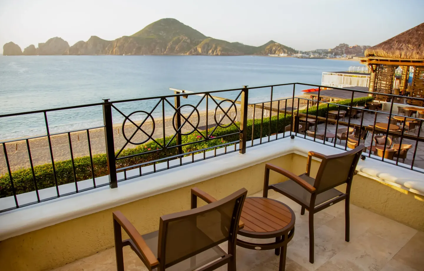 Terrace seating overlooking beach and bay at Casa Dorada Los Cabos Resort & Spa.