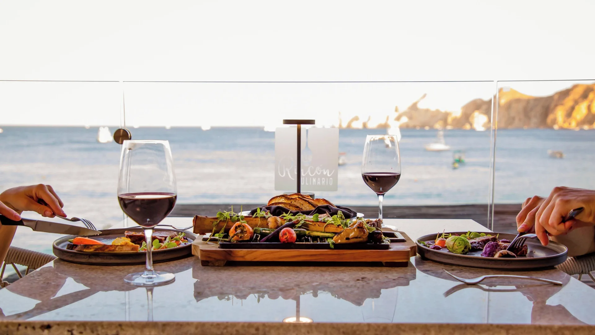 Grilled seafood and wine by the ocean at Casa Dorada Los Cabos Resort & Spa.