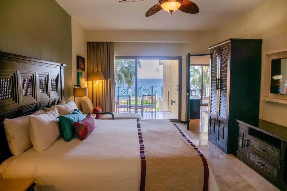 One Bedroom Suite king bed with balcony and ocean view at Casa Dorada Los Cabos Resort & Spa.