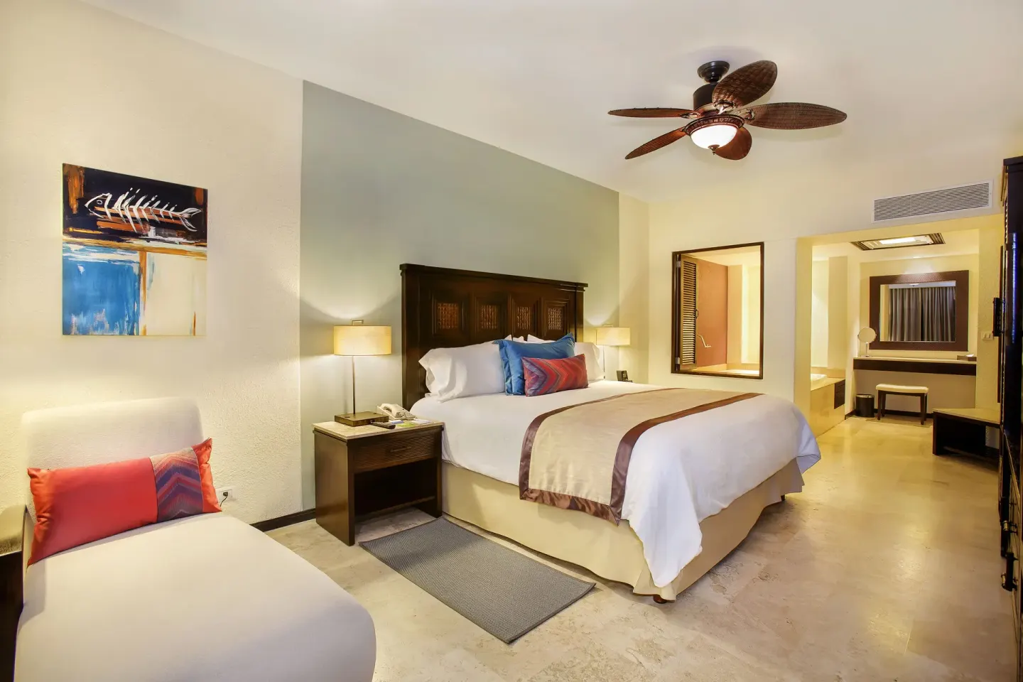 One Bedroom Suite king bed and chaise at Casa Dorada Los Cabos Resort & Spa.