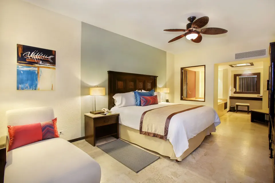One Bedroom Suite king bed and chaise at Casa Dorada Los Cabos Resort & Spa.