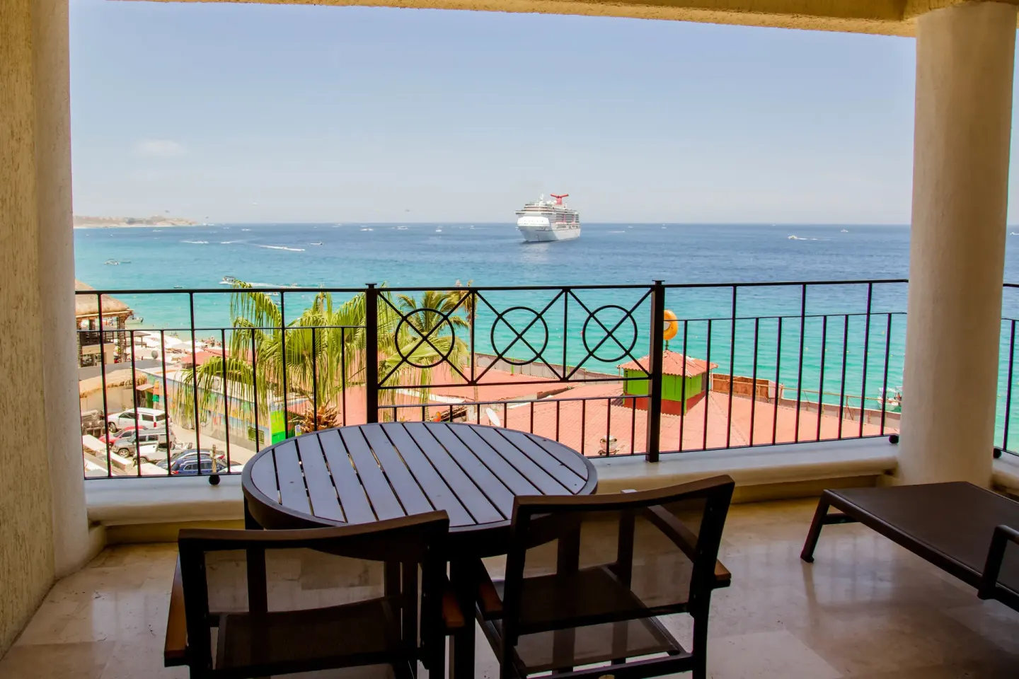 Junior suite balcony dining table overlooking the sea at Casa Dorada Los Cabos Resort & Spa.