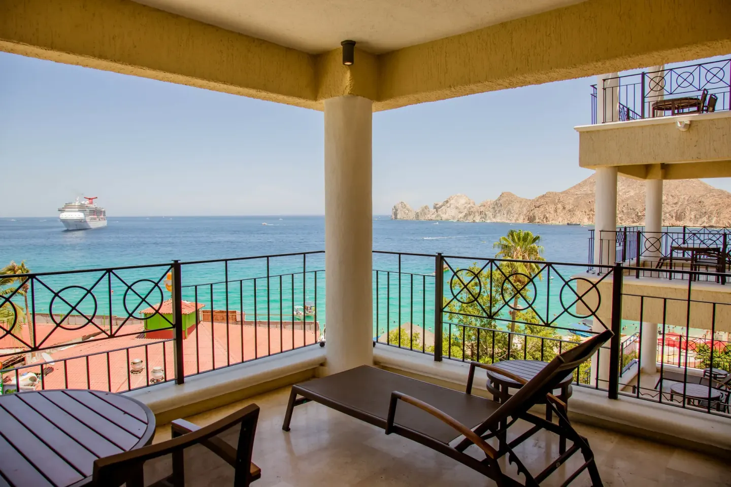 Junior suite balcony with ocean and rock formation view at Casa Dorada Los Cabos Resort & Spa.