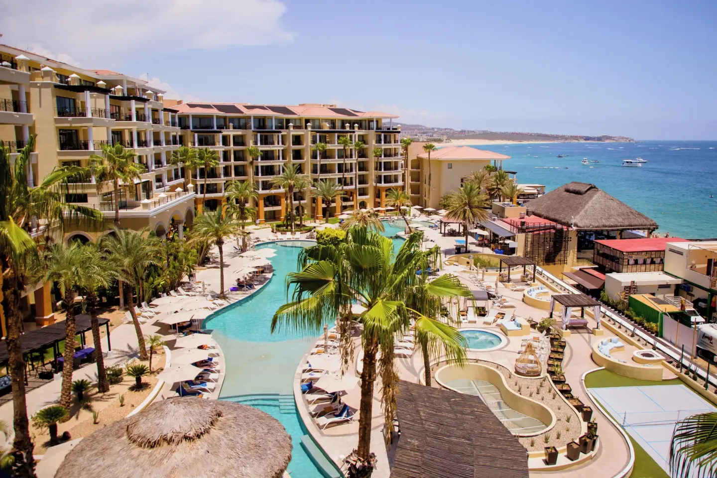 Junior suite balcony view of pools and beachfront at Casa Dorada Los Cabos Resort & Spa.