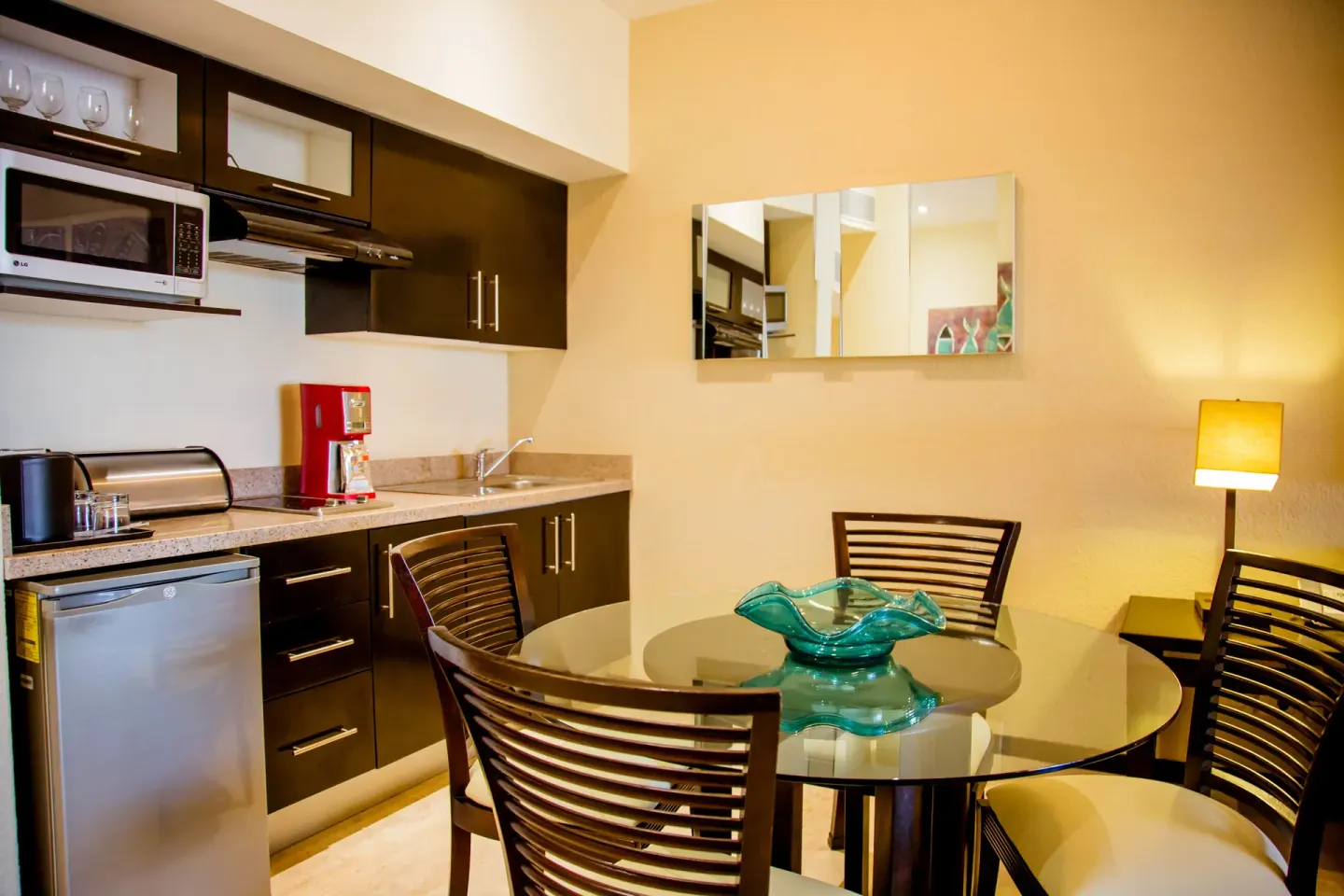 Junior suite kitchenette and dining table at Casa Dorada Los Cabos Resort & Spa.