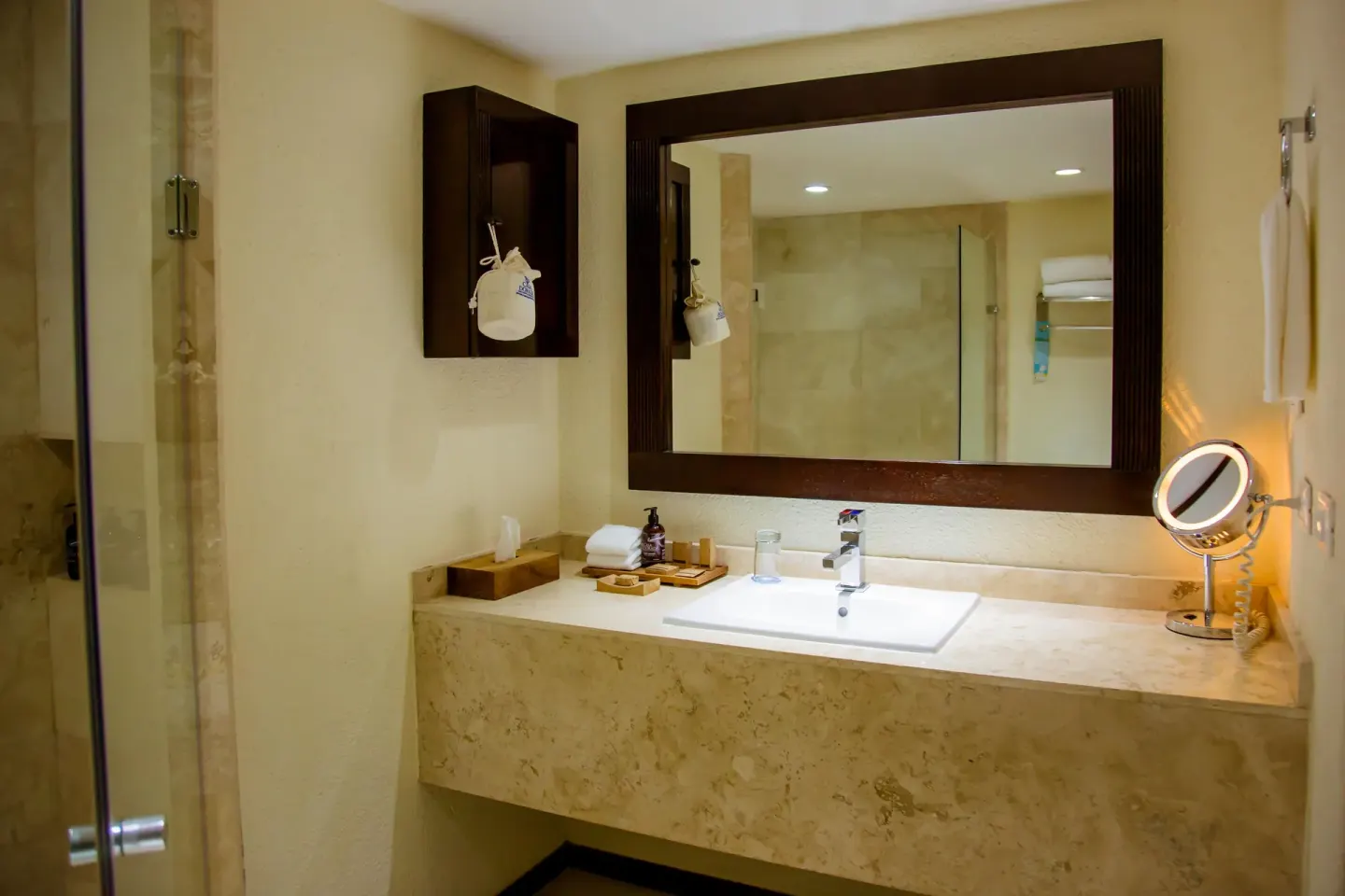 One Bedroom Plus bathroom vanity and glass shower at Casa Dorada Los Cabos Resort & Spa.