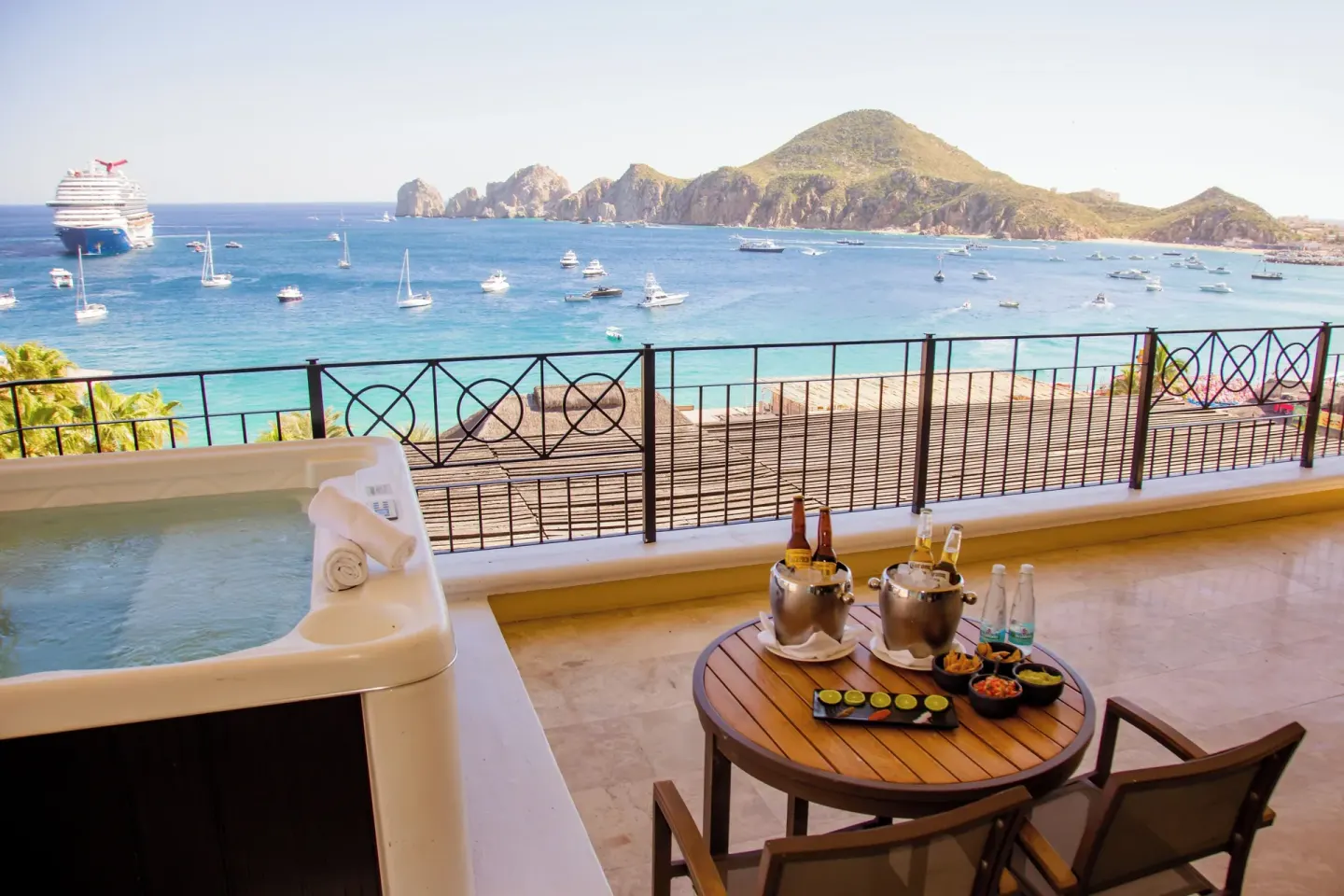 Penthouse terrace with hot tub and ocean-view table at Casa Dorada Los Cabos Resort & Spa.