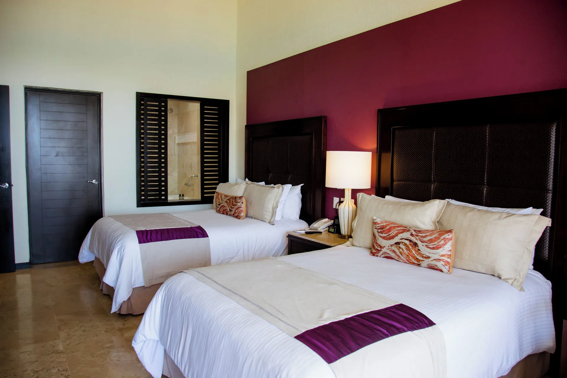 One Bedroom Penthouse at Casa Dorada Los Cabos Resort and Spa with elegant beds and upscale finishes in Cabo San Lucas.