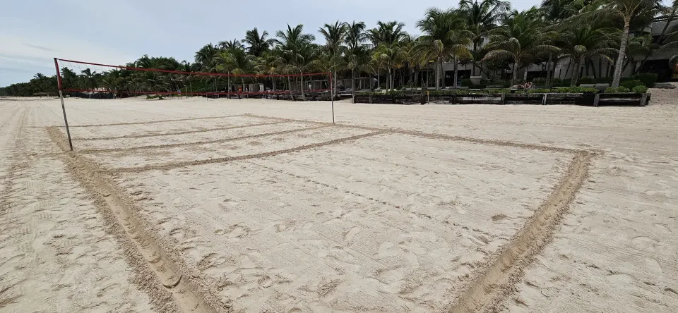 Marked beach volleyball court on the sand in front of Casa Malca.