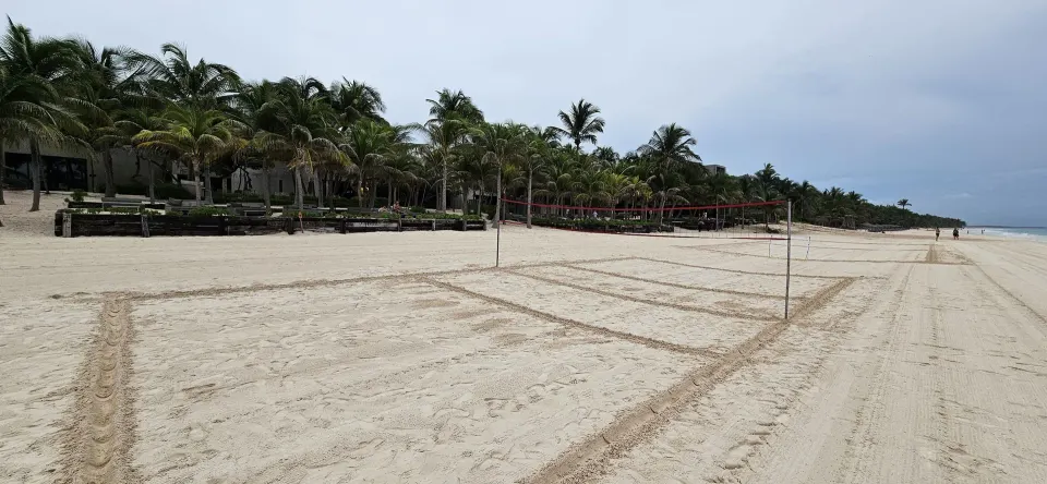 Another view of the beachfront volleyball nets and resort palms at Casa Malca.