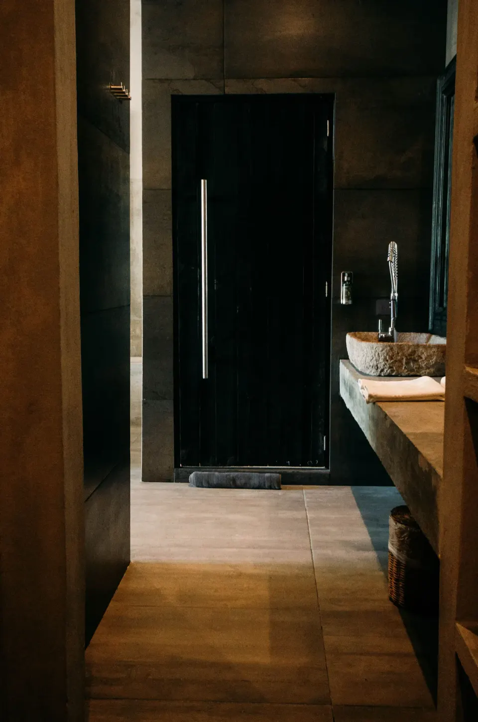 Bathroom doorway and partial vanity view in Junior Suite Garden View at Casa Malca