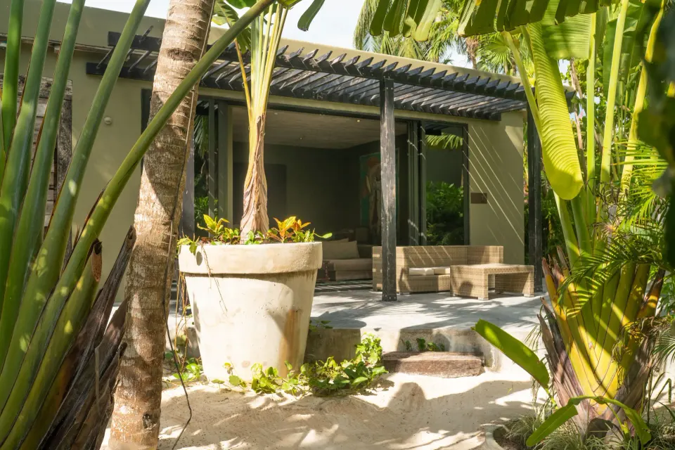 Terrace and shaded outdoor seating outside the junior suite Garden View at Casa Malca